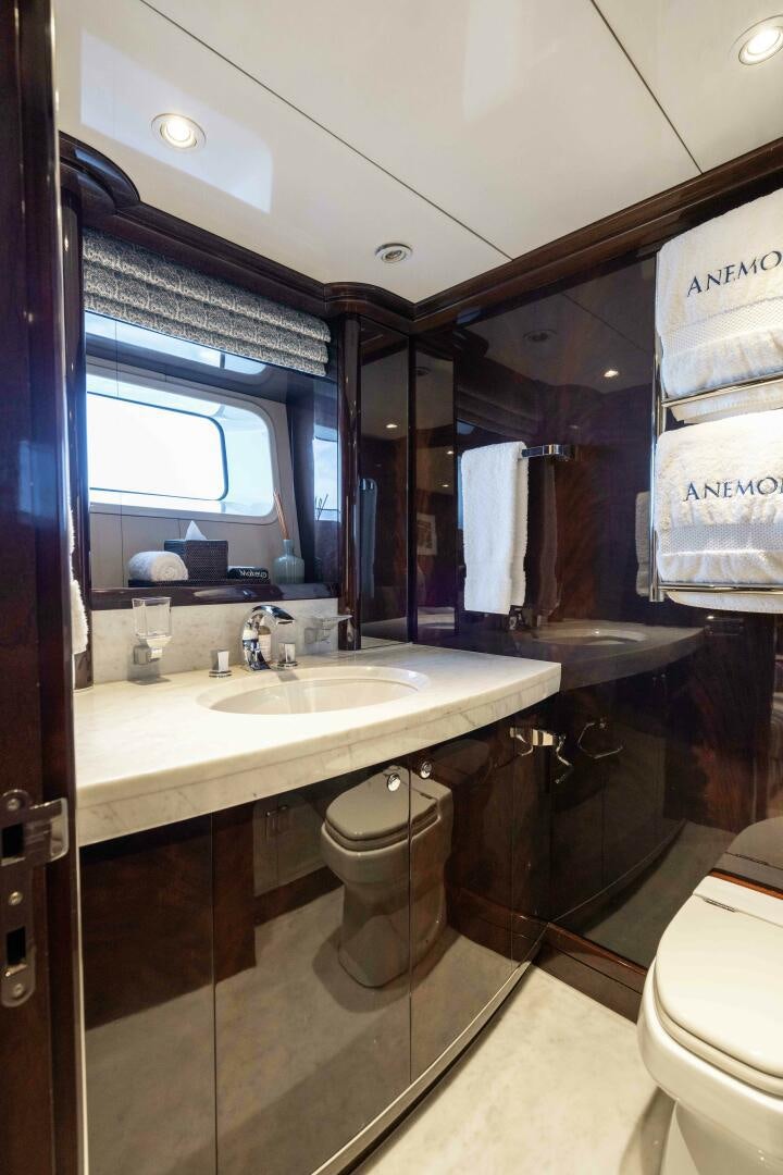 a bathroom with a sink and a mirror aboard ANEMOI Yacht for Sale