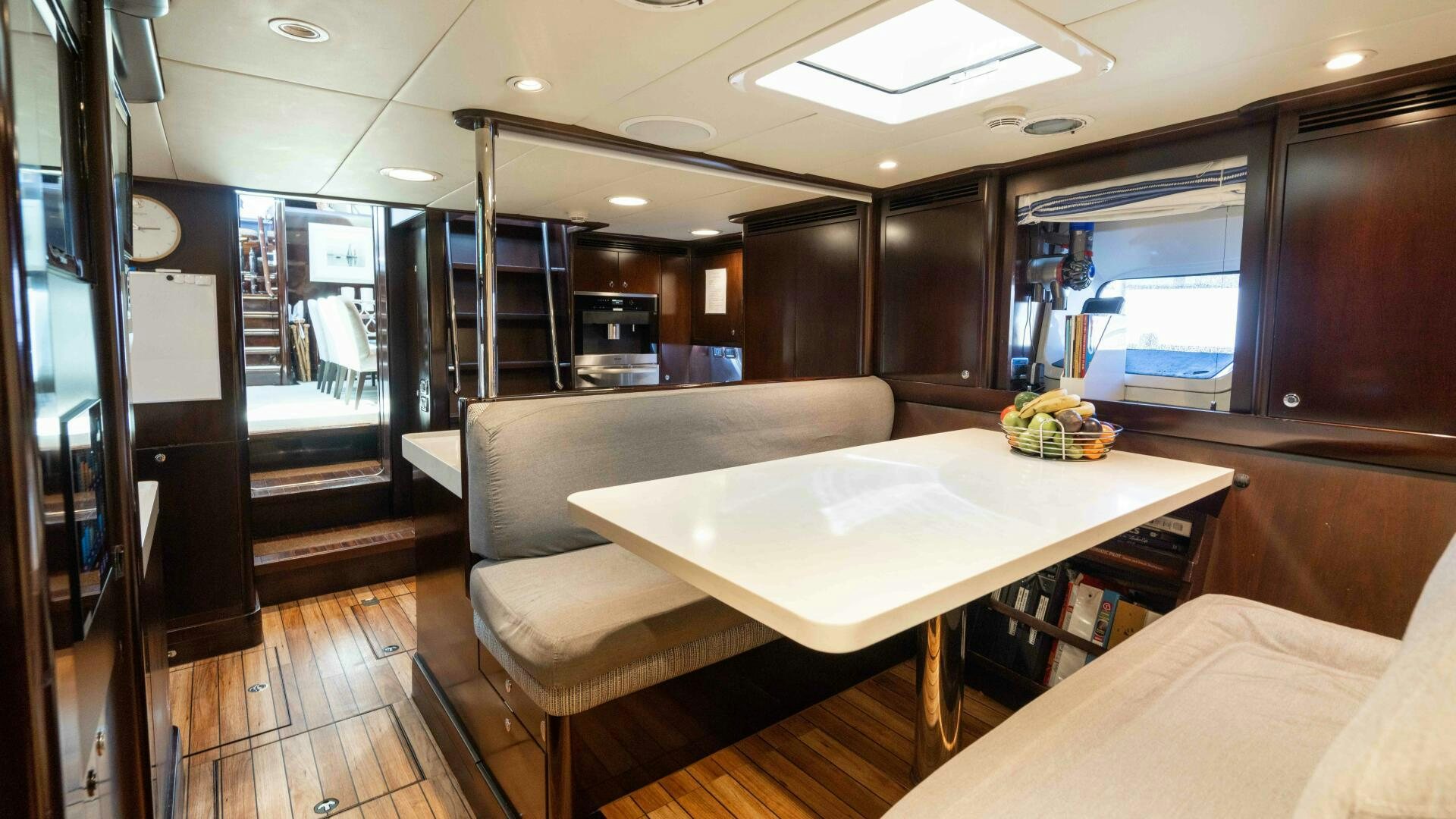 a room with a table and chairs aboard ANEMOI Yacht for Sale