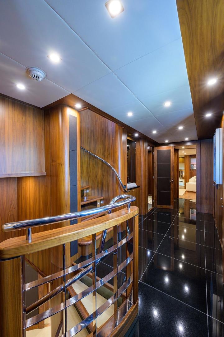 a room with wooden walls and a staircase aboard SULLIVAN'S ISLAND Yacht for Sale