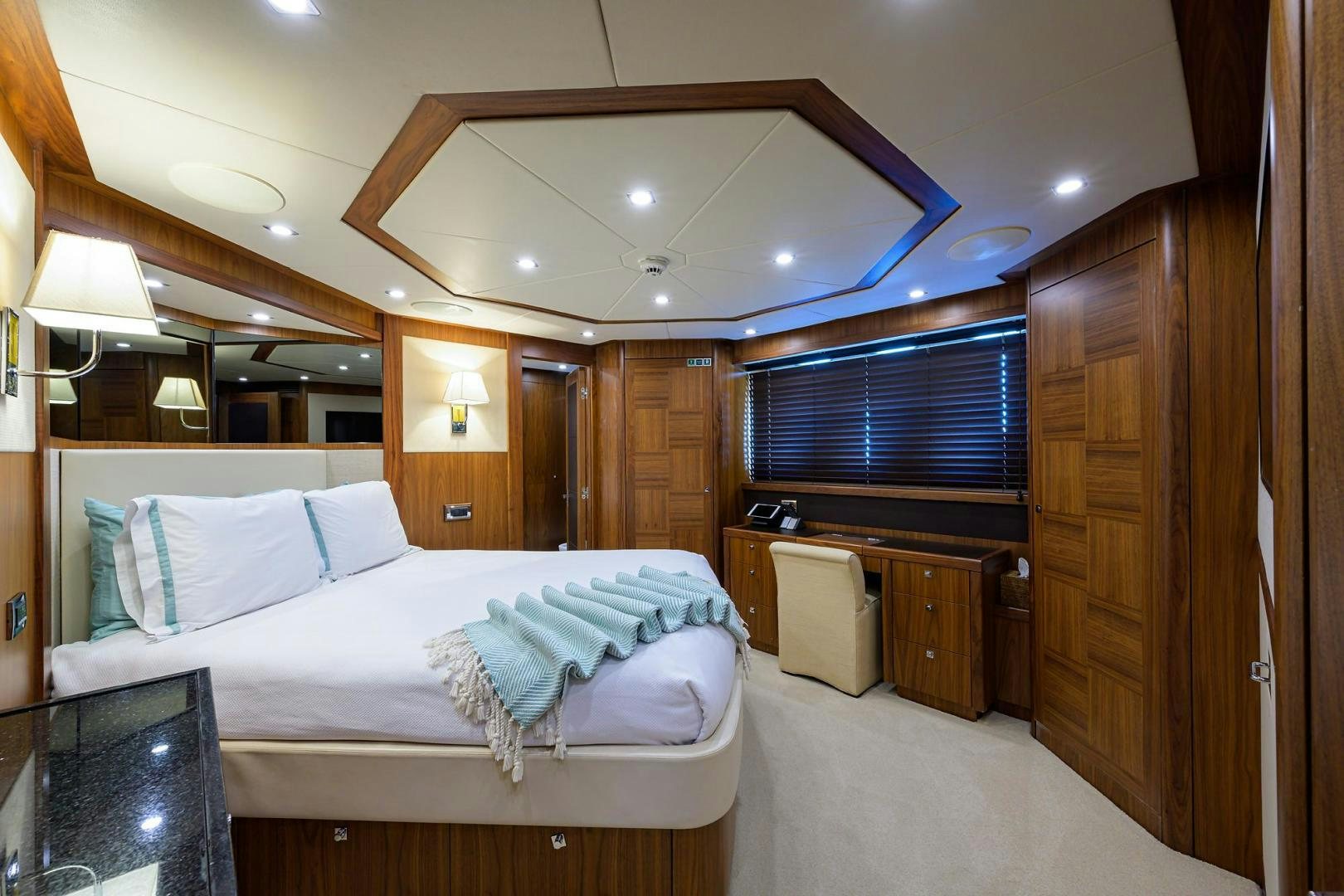 a bedroom with a bed and a desk aboard SULLIVAN'S ISLAND Yacht for Sale