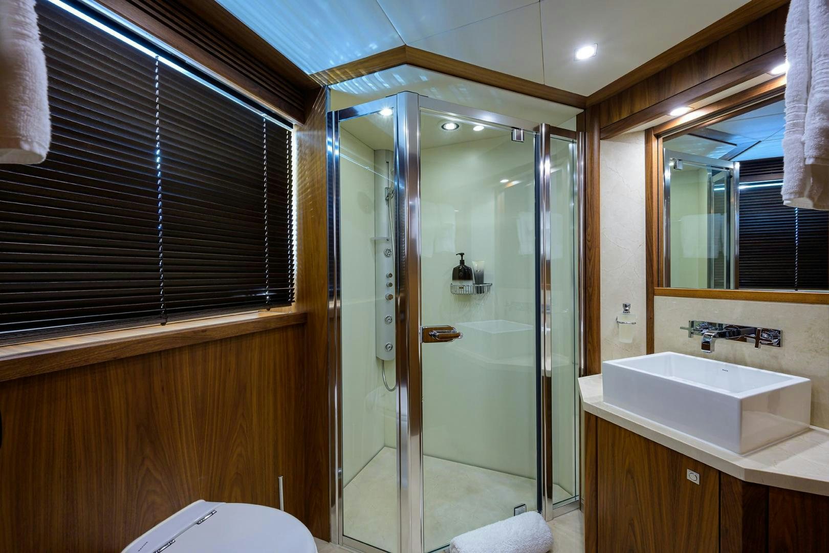 a bathroom with a glass shower aboard SULLIVAN'S ISLAND Yacht for Sale