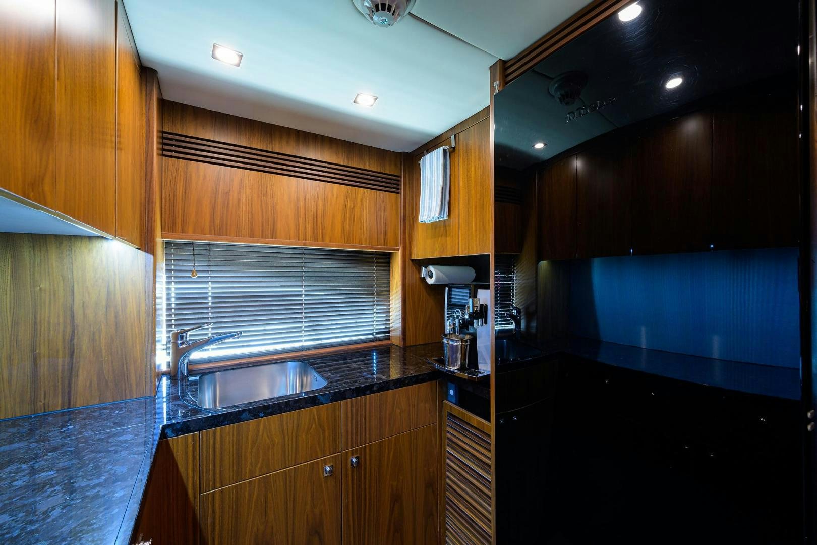 a kitchen with wooden cabinets aboard SULLIVAN'S ISLAND Yacht for Sale