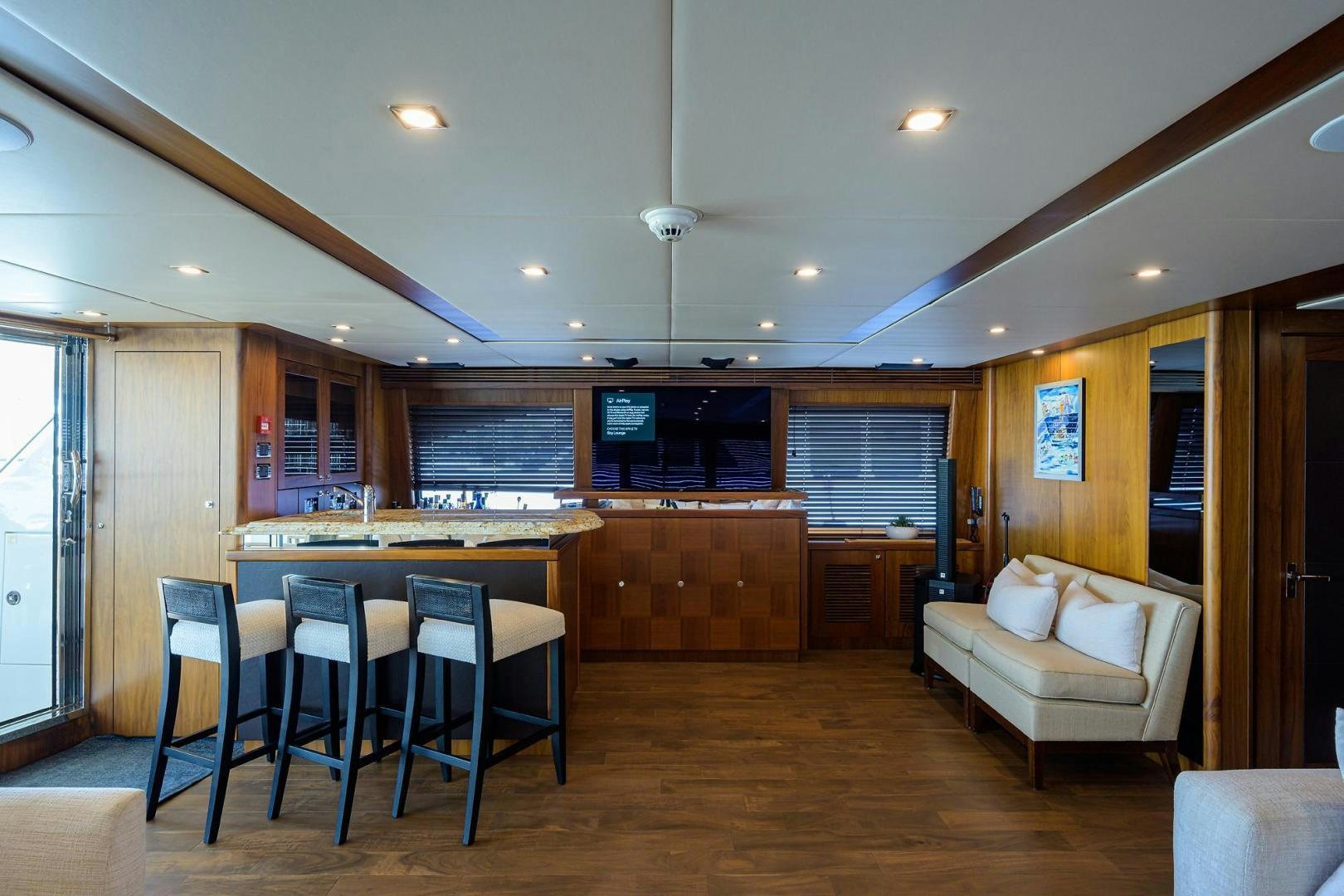 a living room with a kitchen and dining area aboard SULLIVAN'S ISLAND Yacht for Sale
