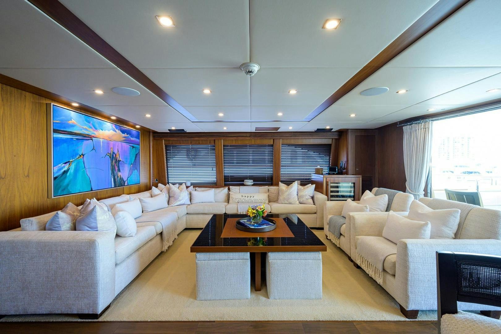 a living room with a large screen aboard SULLIVAN'S ISLAND Yacht for Sale