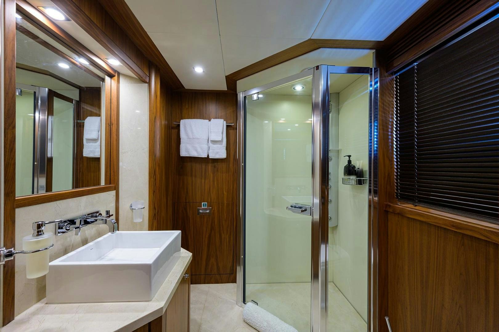a bathroom with a glass shower aboard SULLIVAN'S ISLAND Yacht for Sale