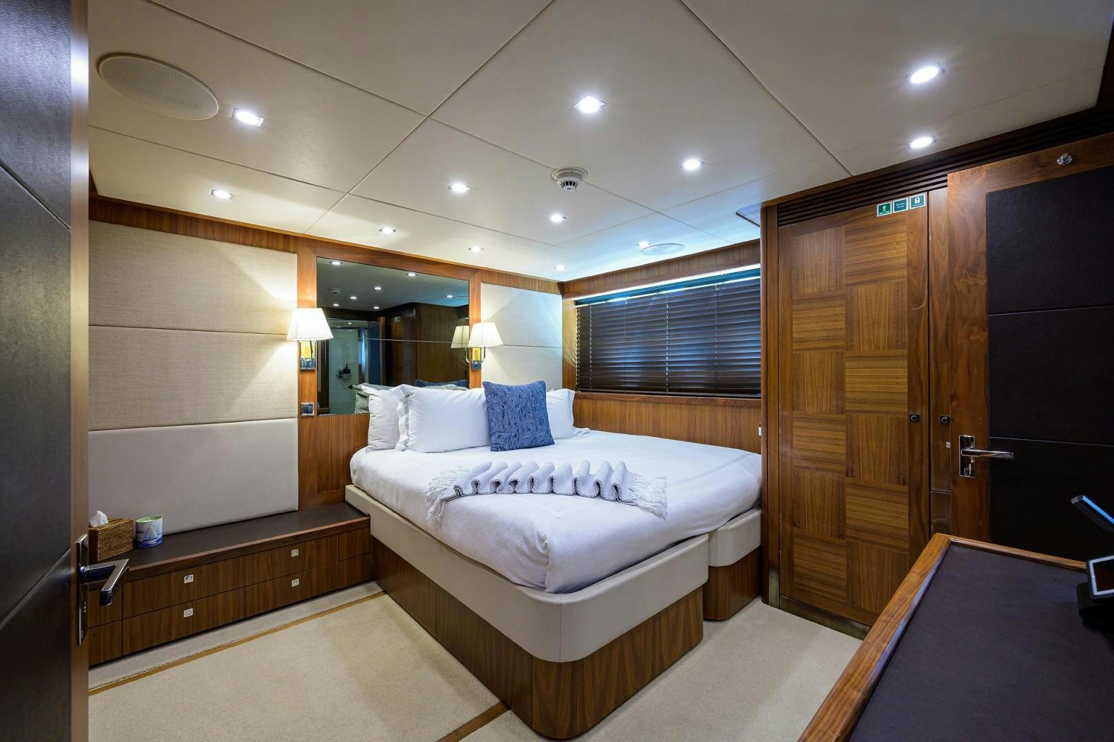 a room with a bed and a mirror aboard SULLIVAN'S ISLAND Yacht for Sale