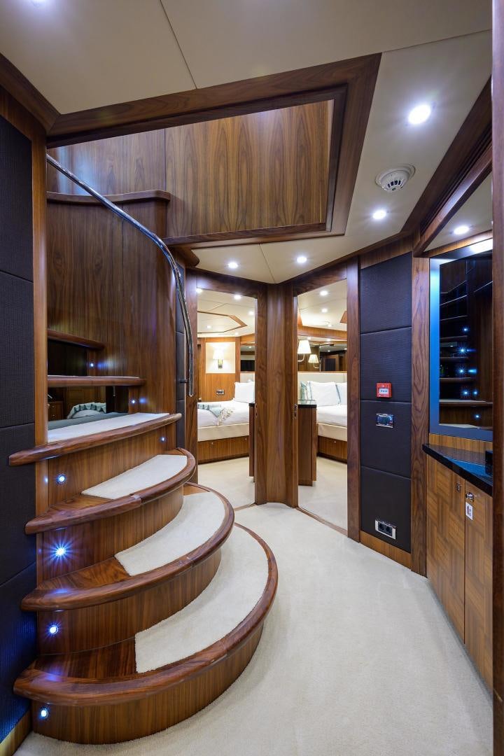 a large wooden staircase in a room aboard SULLIVAN'S ISLAND Yacht for Sale
