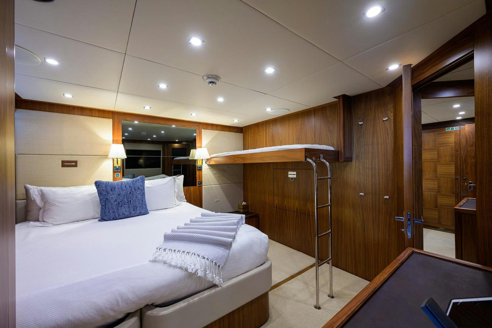 a room with a bed and a desk aboard SULLIVAN'S ISLAND Yacht for Sale