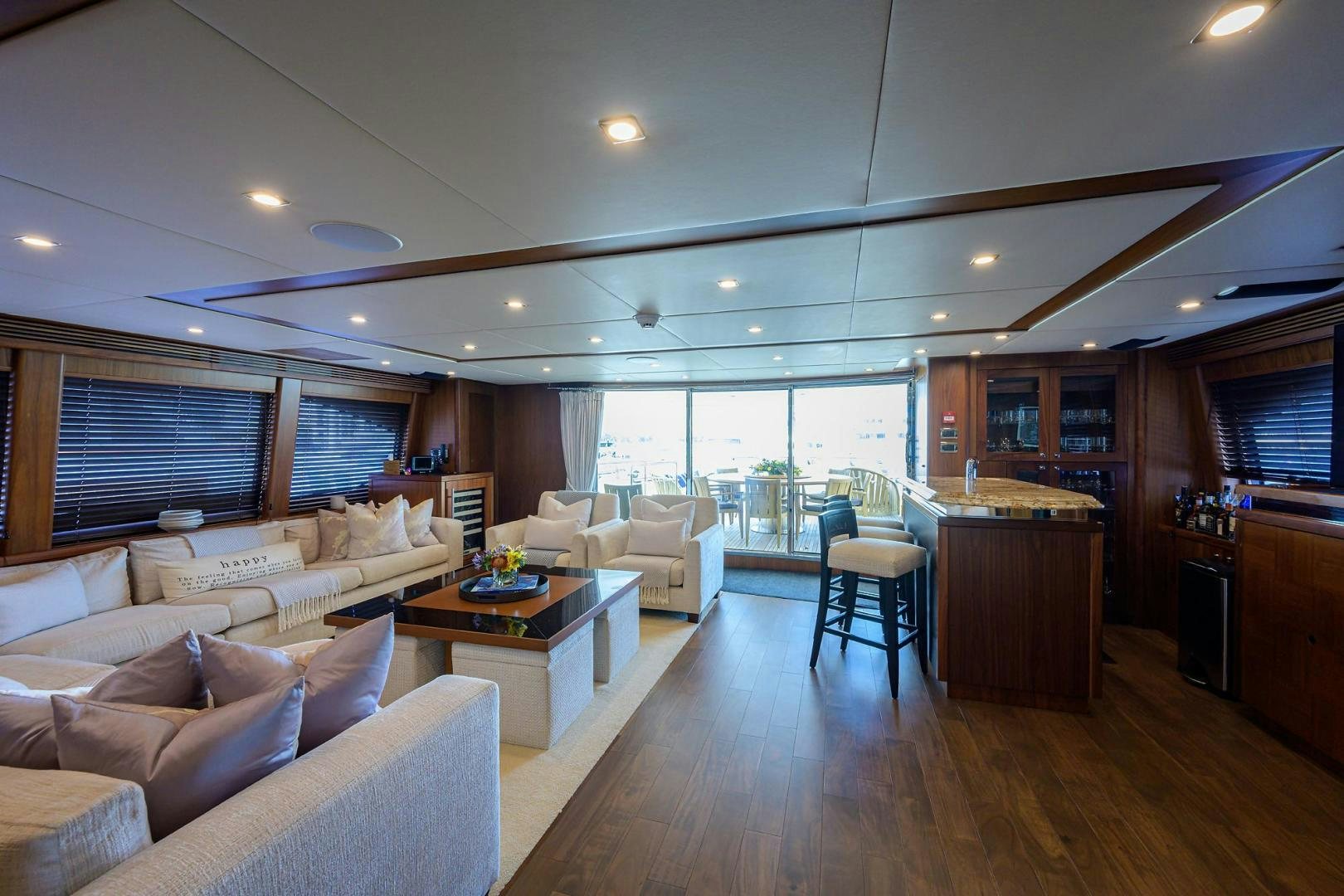 a living room with a large window aboard SULLIVAN'S ISLAND Yacht for Sale
