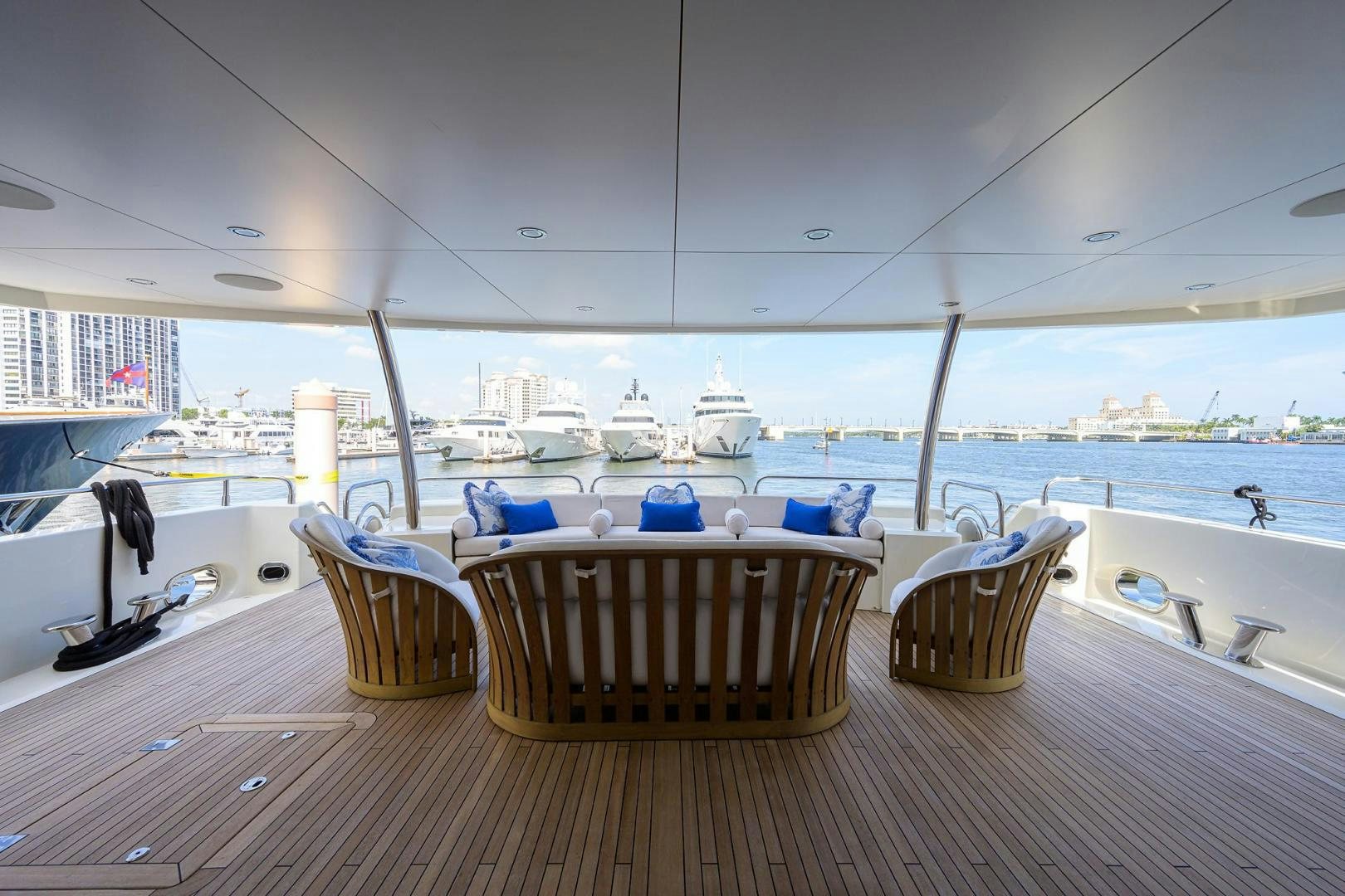a table and chairs on a deck overlooking a body of water aboard SULLIVAN'S ISLAND Yacht for Sale