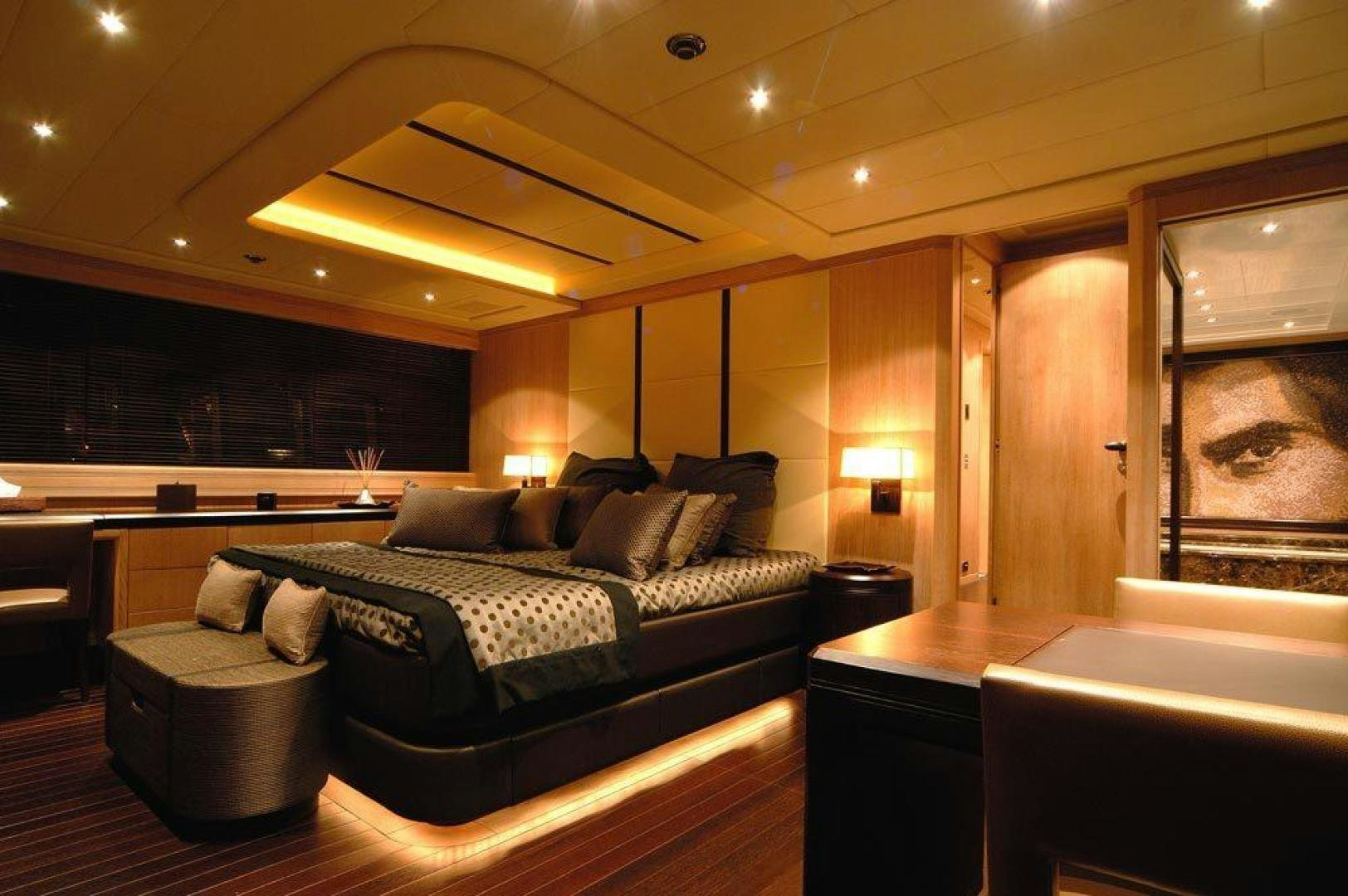 a large bedroom with a large bed aboard ARES Yacht for Sale