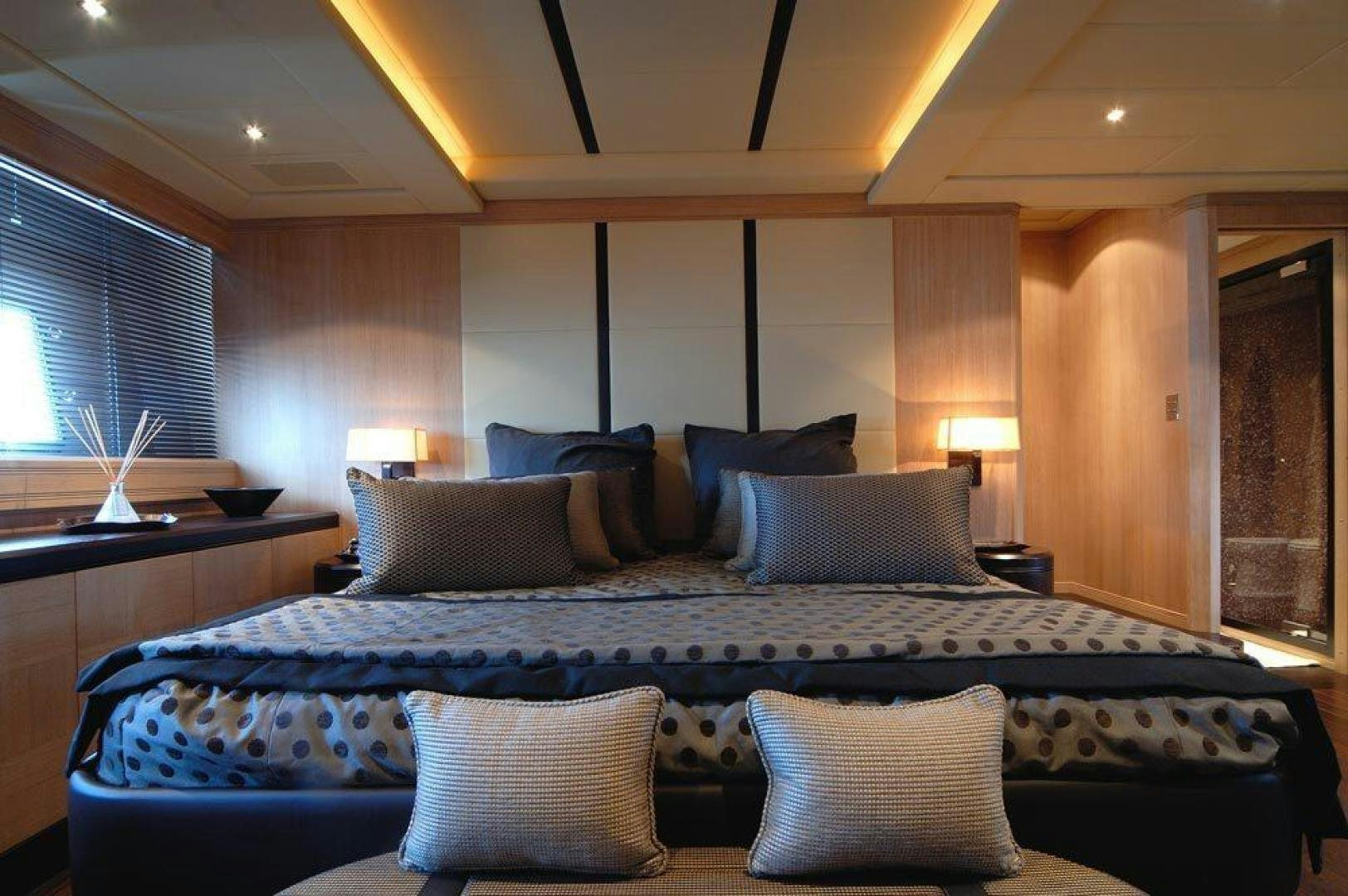 a large bed with pillows aboard ARES Yacht for Sale