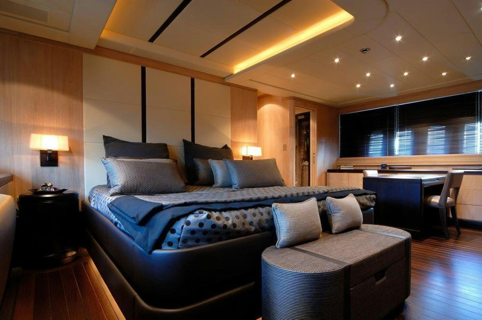 a large bed in a room aboard ARES Yacht for Sale