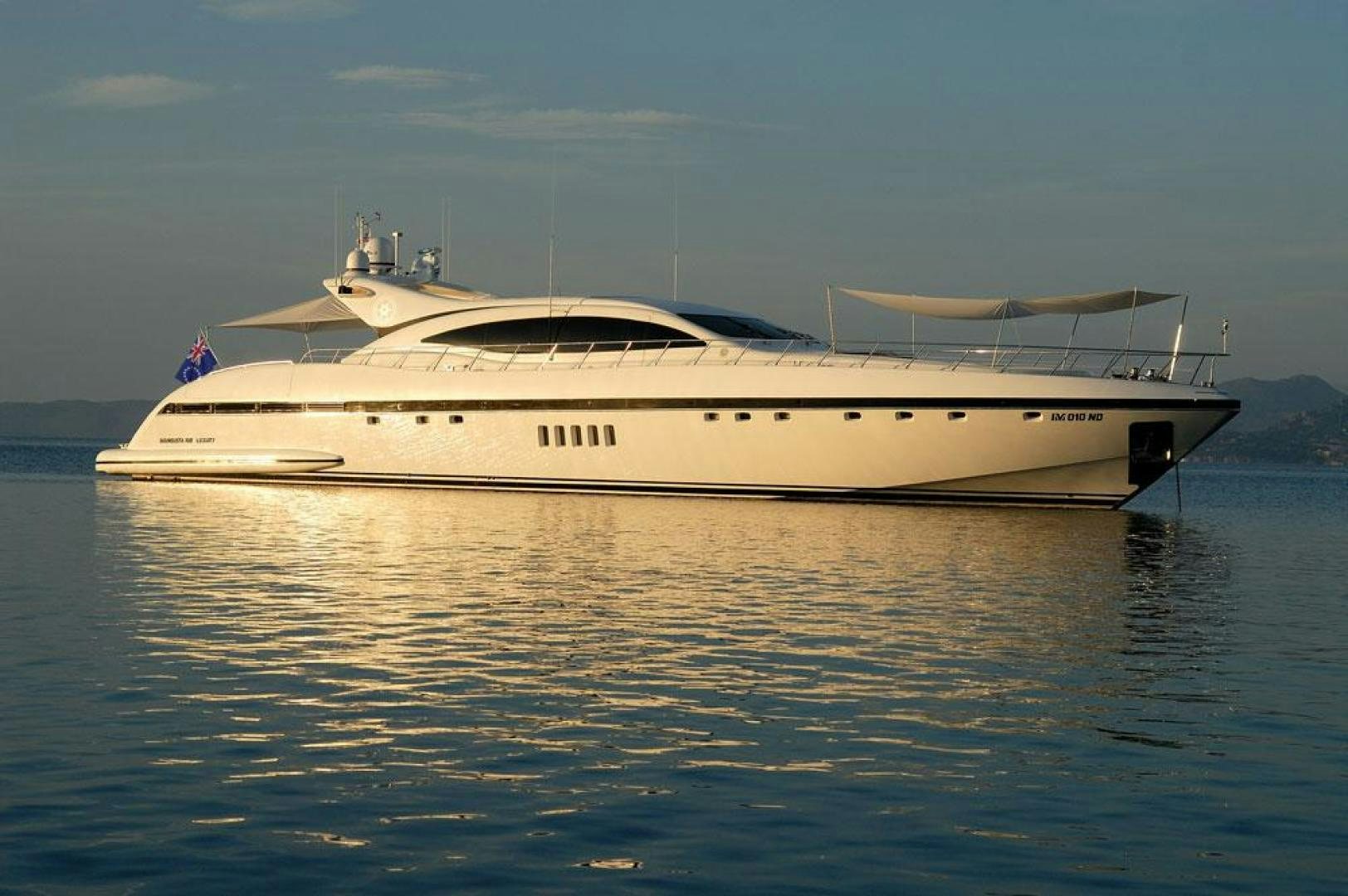 a white yacht on the water aboard ARES Yacht for Sale