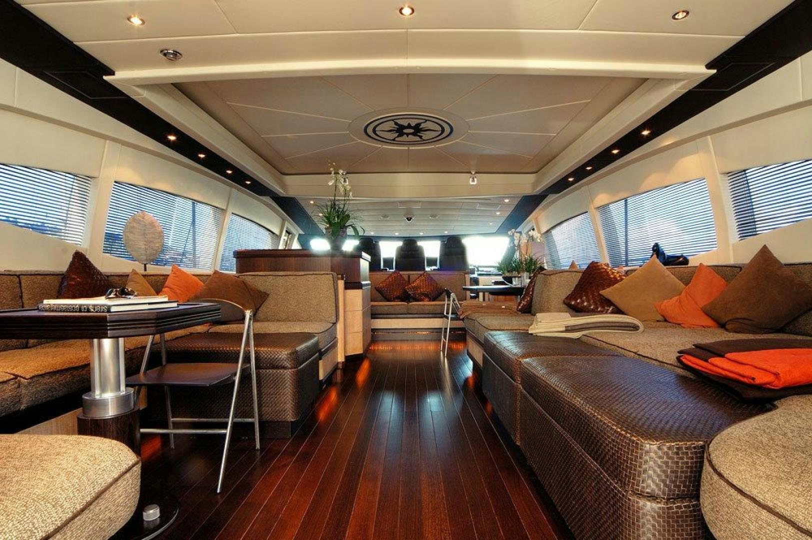 a living room with a couch and a table aboard ARES Yacht for Sale