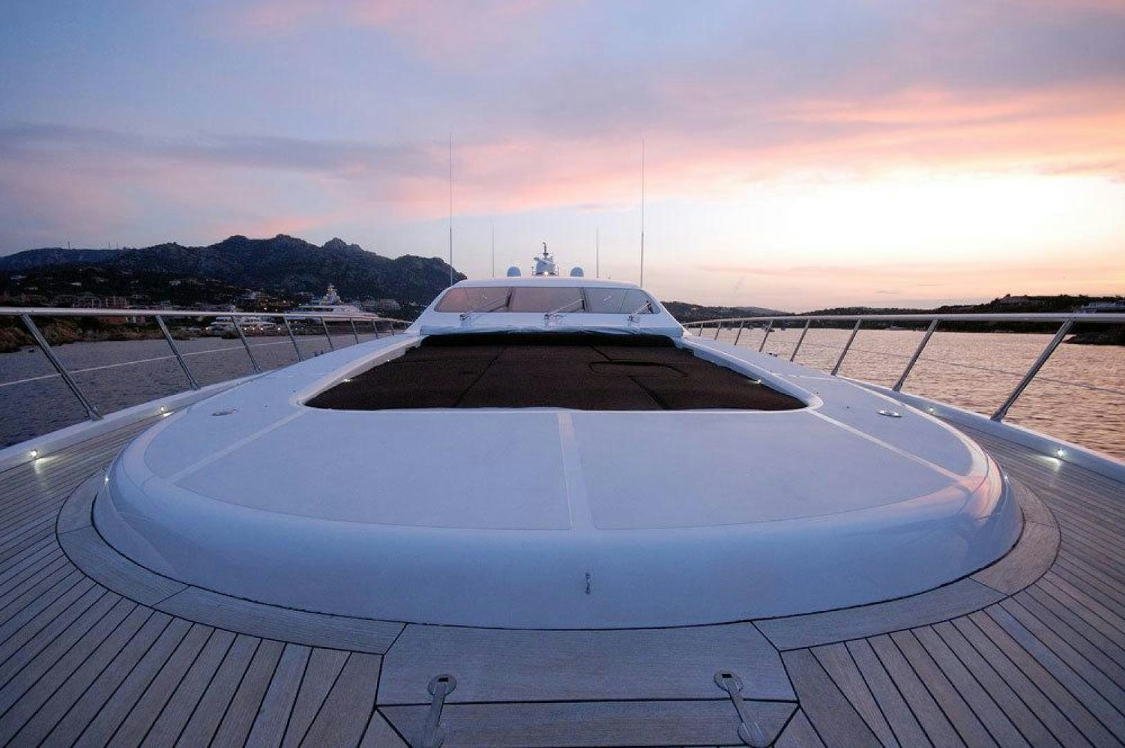 a white yacht on a deck aboard ARES Yacht for Sale