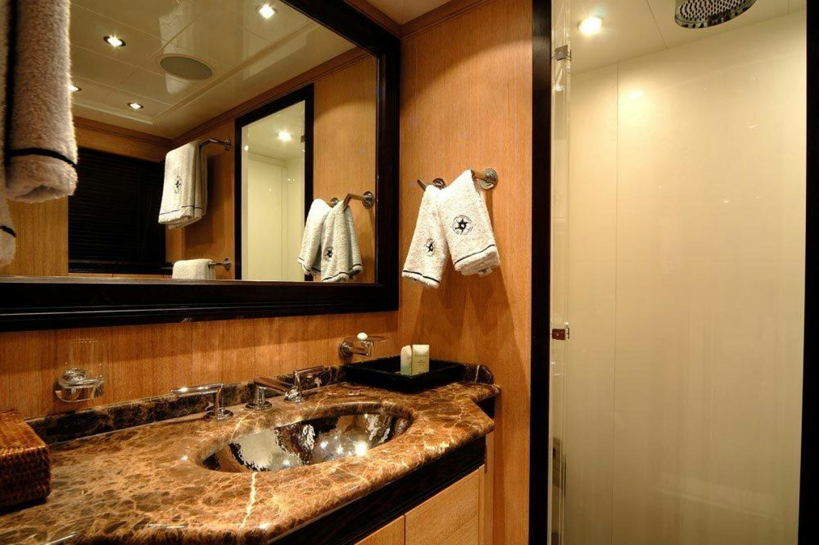 a bathroom with a sink and a mirror aboard ARES Yacht for Sale