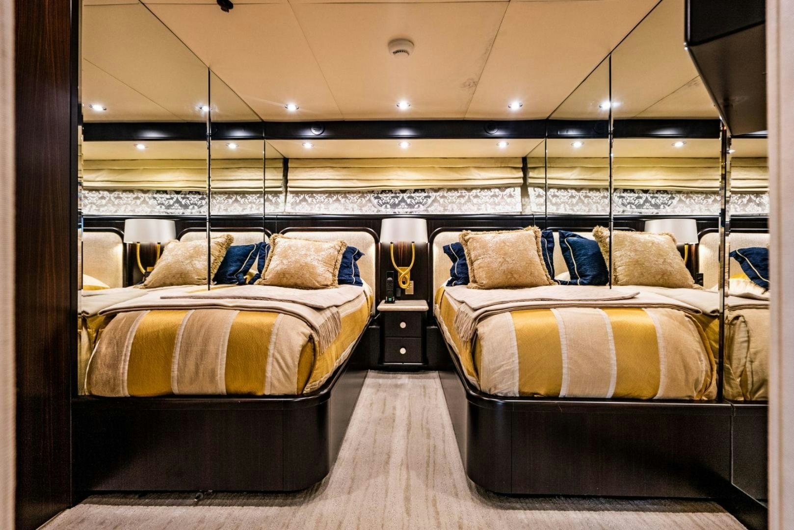 a couple of beds in a room aboard GRADE I Yacht for Sale
