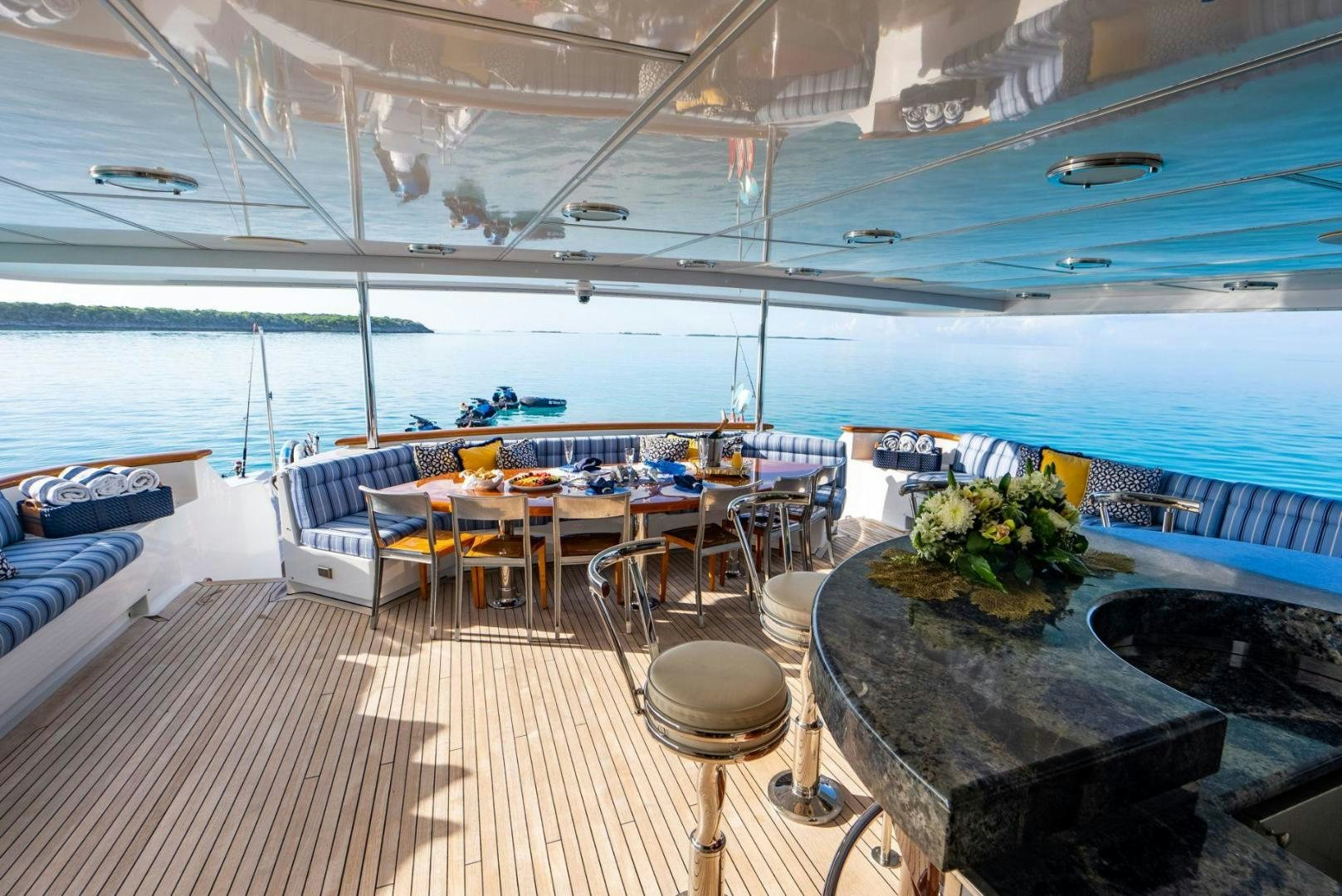 a room with a table and chairs aboard GRADE I Yacht for Sale