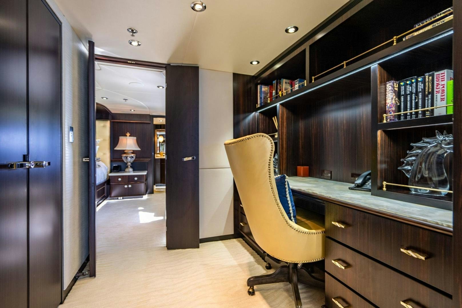 a room with a desk and a chair aboard GRADE I Yacht for Sale