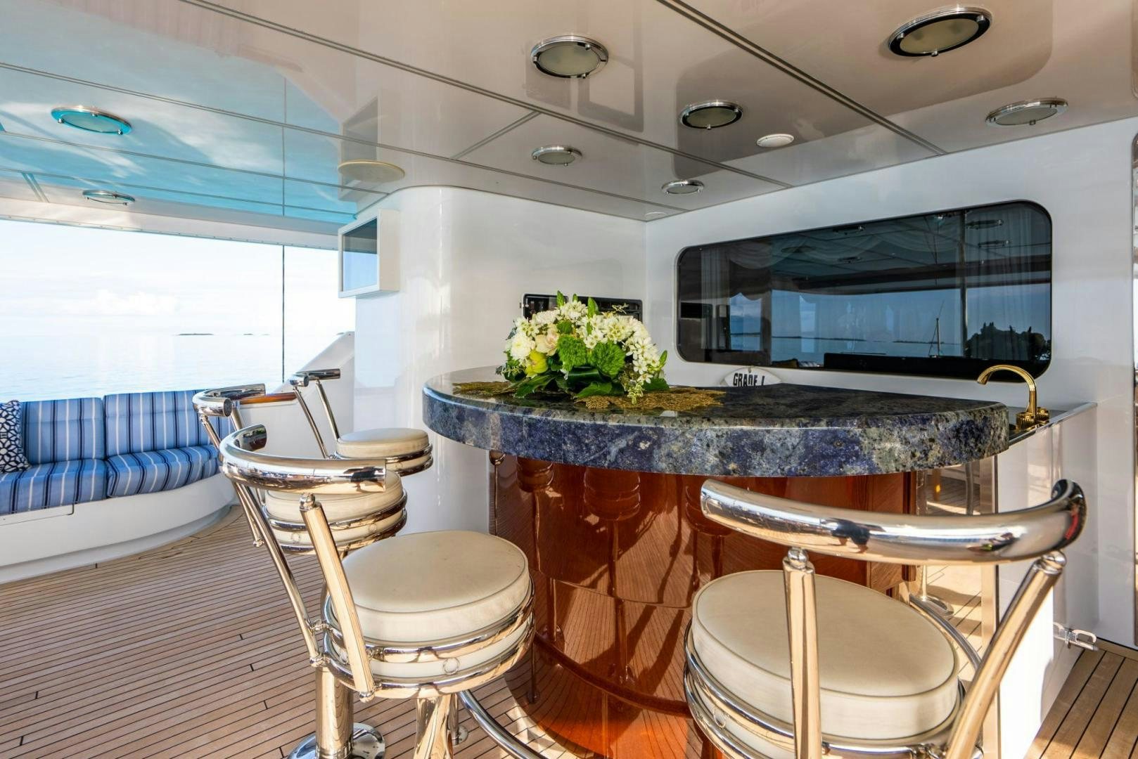 a large kitchen with a large marble counter top aboard GRADE I Yacht for Sale