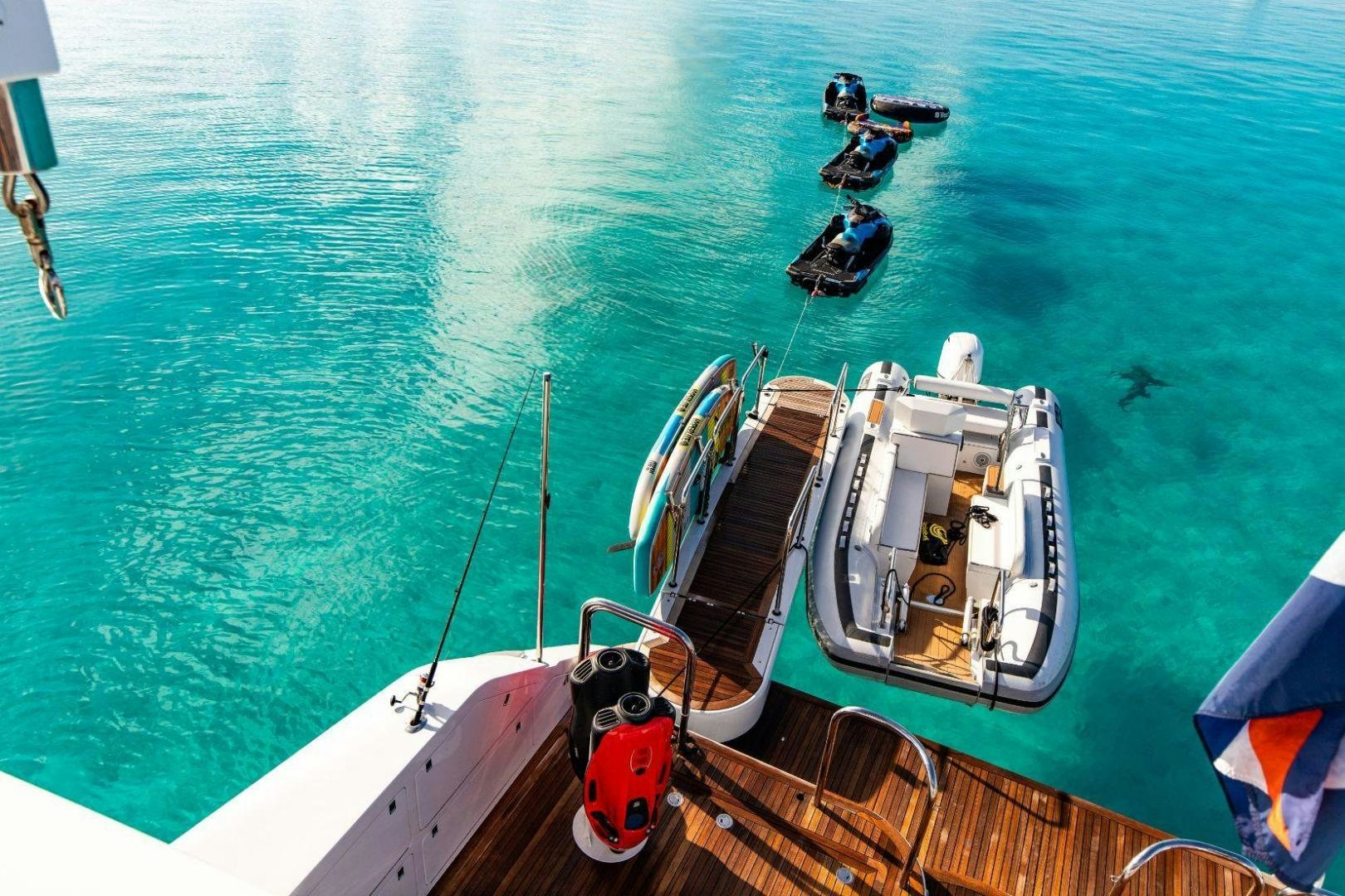 a boat with a flag on it aboard GRADE I Yacht for Sale