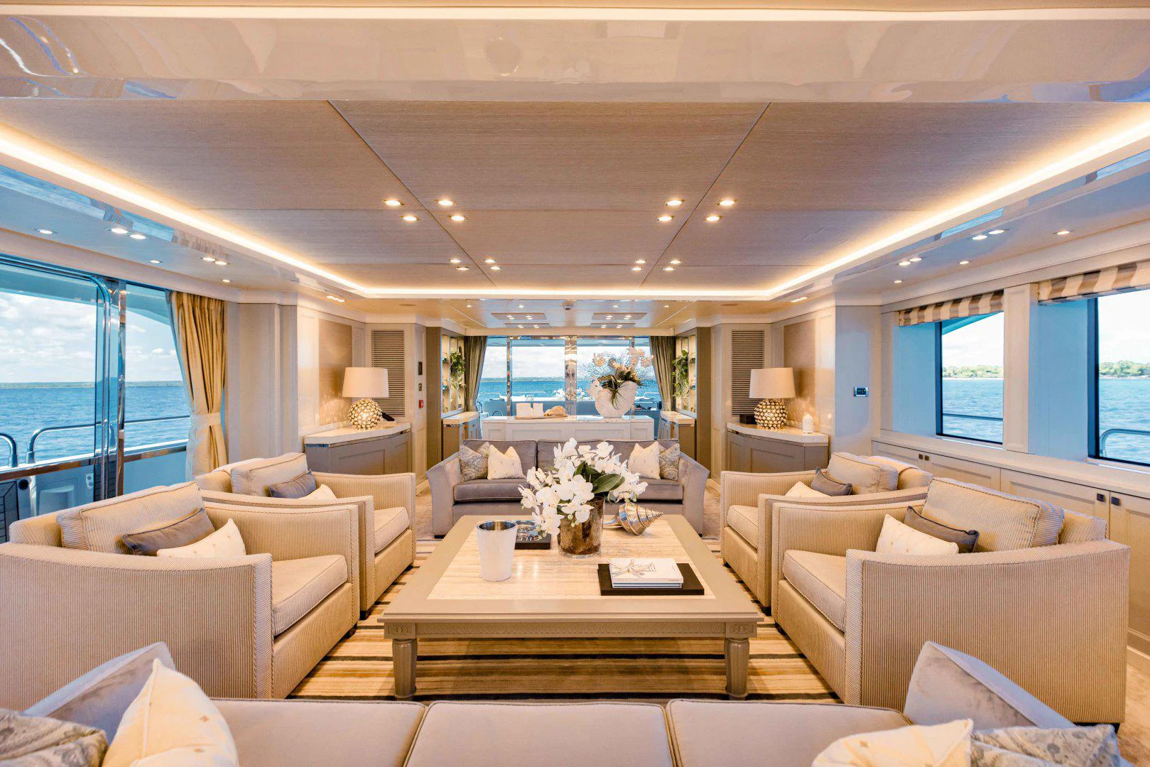 a living room with a large window aboard TAYRONA Yacht for Sale