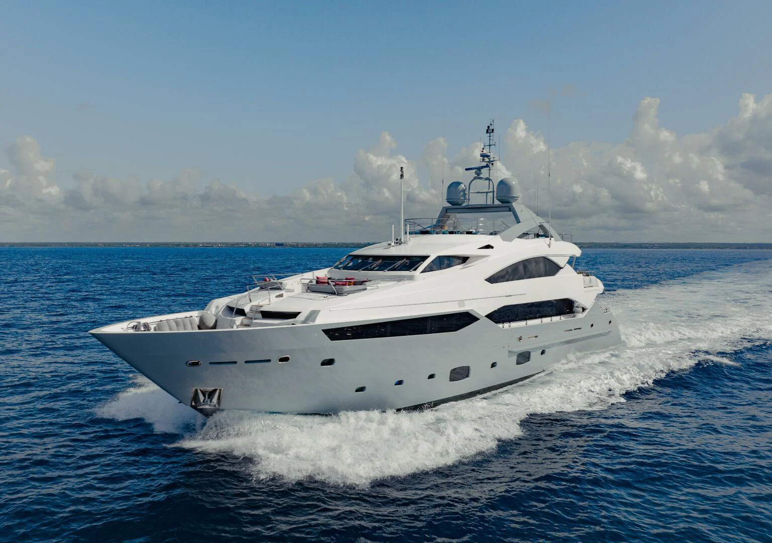 a white yacht on the water aboard TAYRONA Yacht for Sale