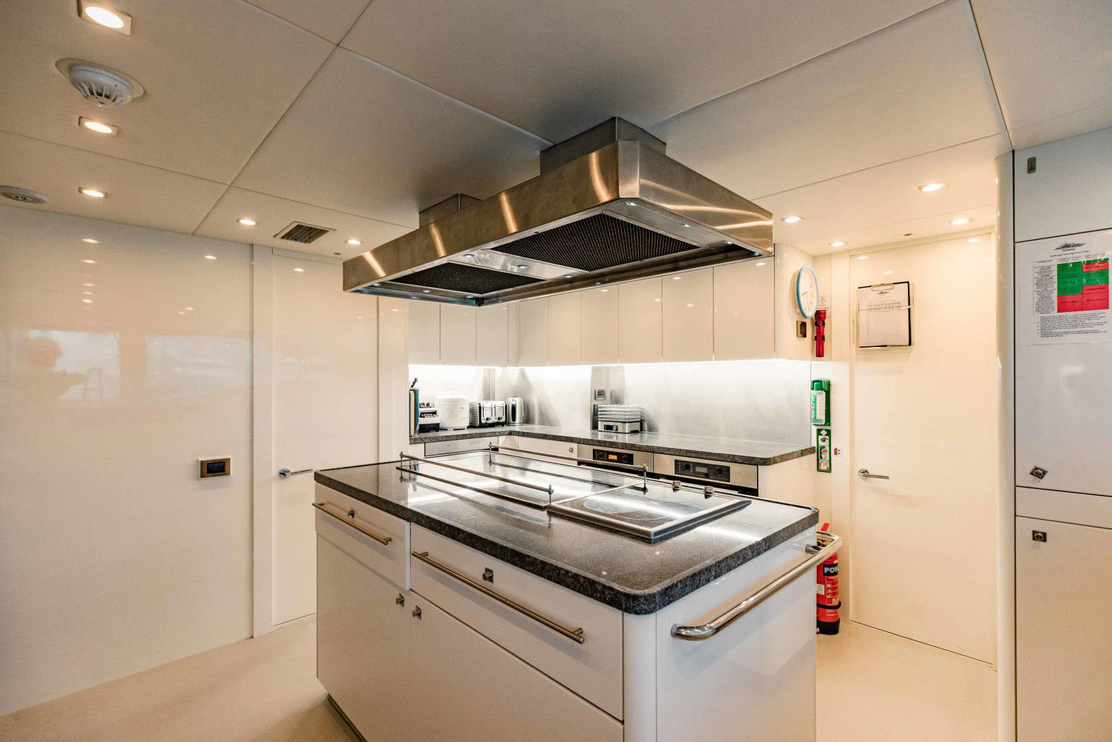 a kitchen with a stove and oven aboard TAYRONA Yacht for Sale