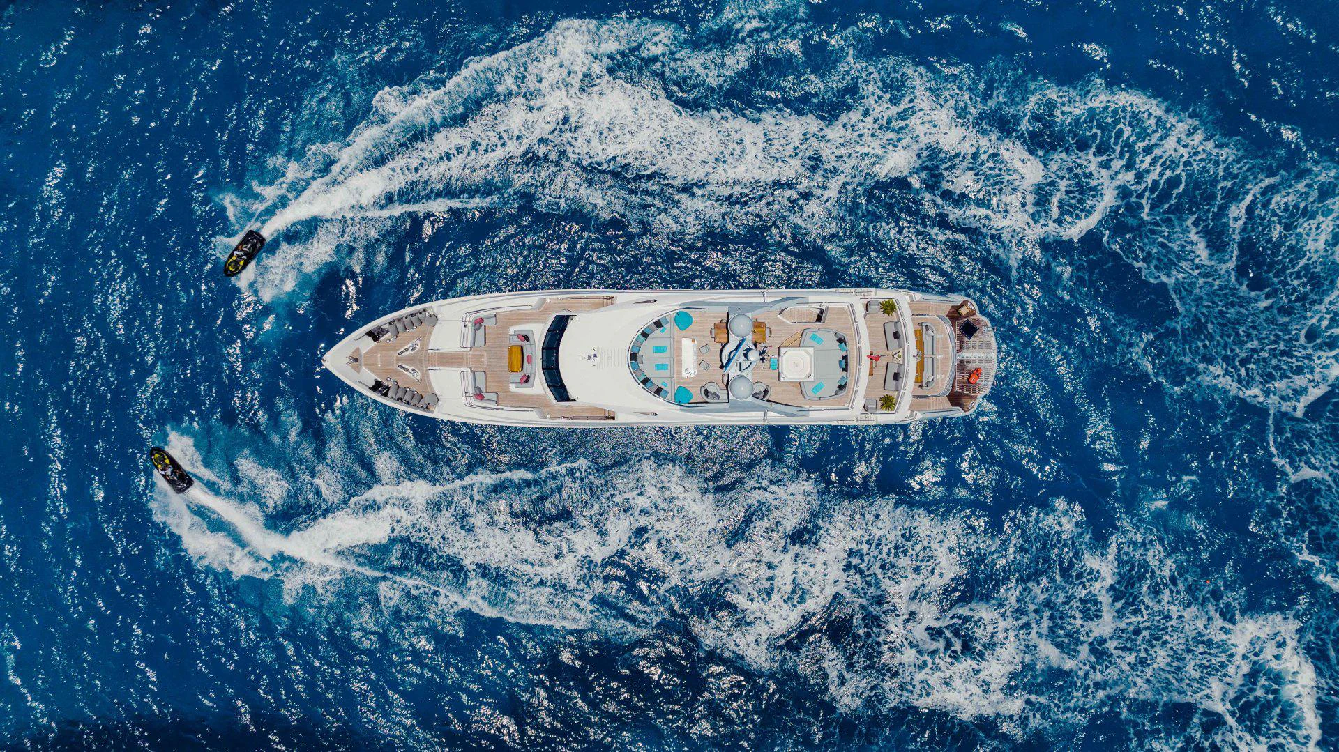 a white and black boat in the water aboard TAYRONA Yacht for Sale