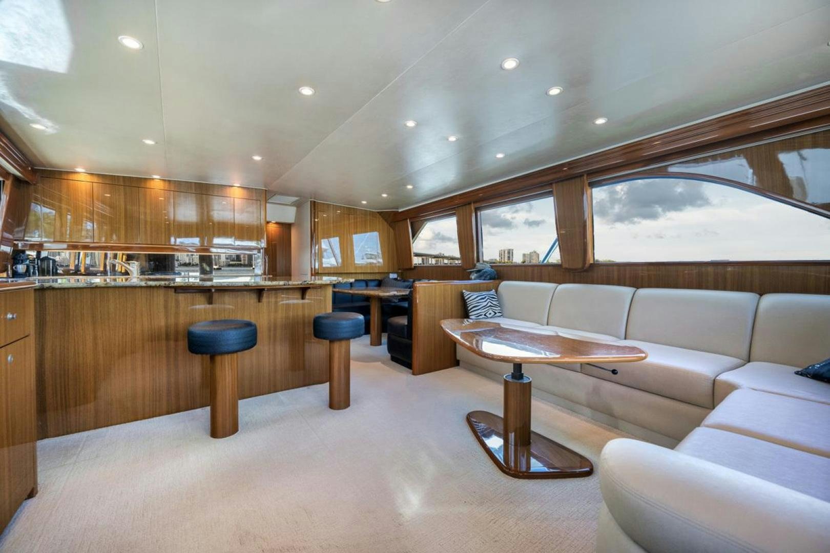 a living room with a couch and a table aboard 68 VIKING Yacht for Sale