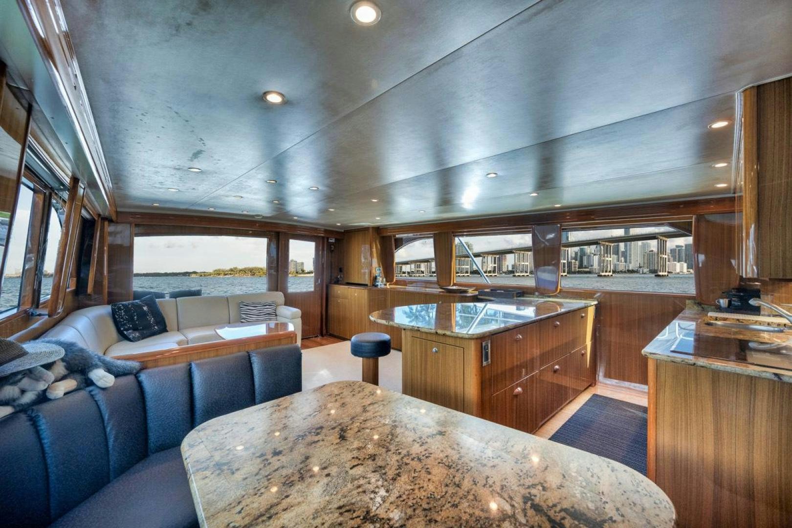 a large kitchen with a large round table aboard 68 VIKING Yacht for Sale