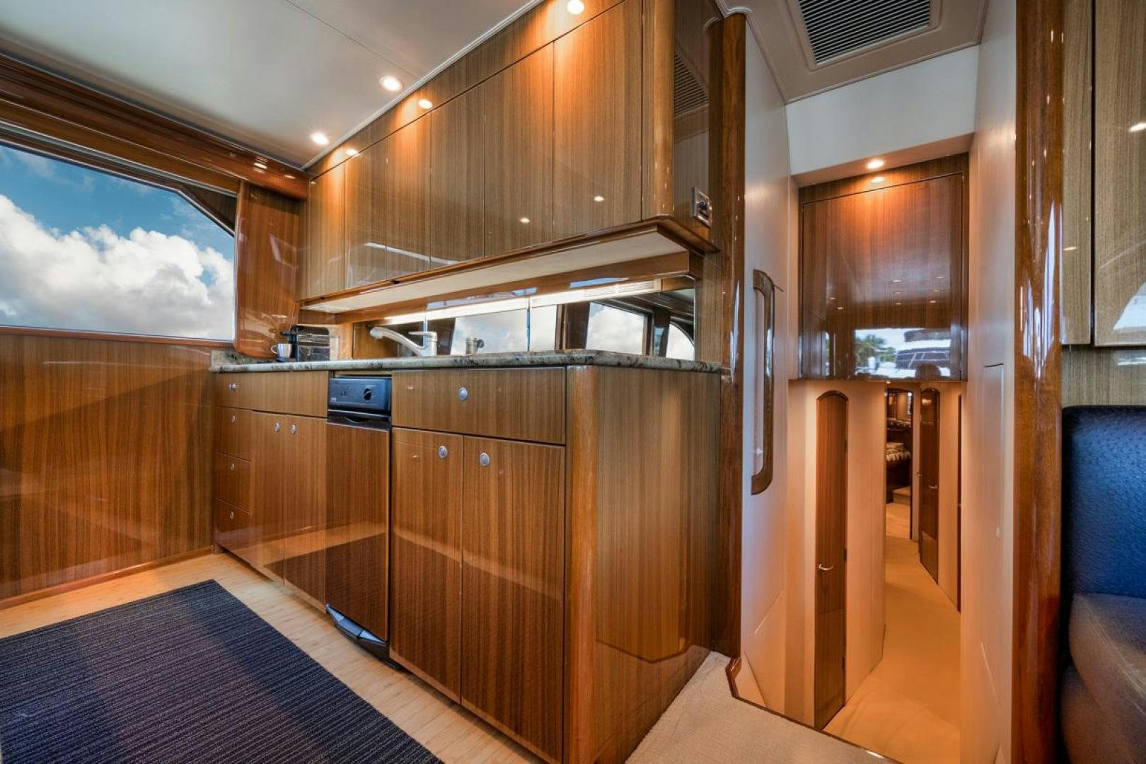 a room with wooden cabinets aboard 68 VIKING Yacht for Sale
