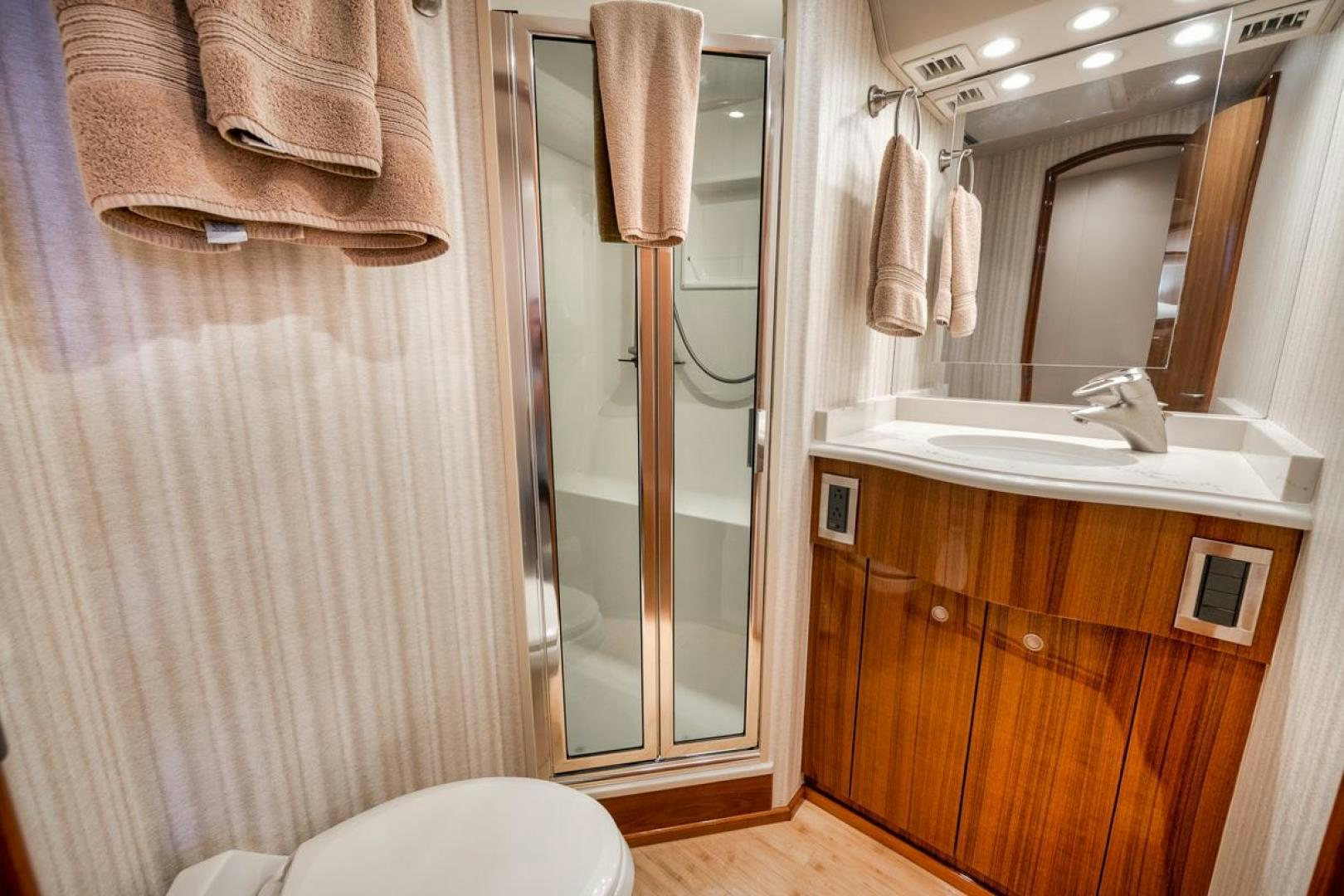 a bathroom with a standup shower aboard 68 VIKING Yacht for Sale