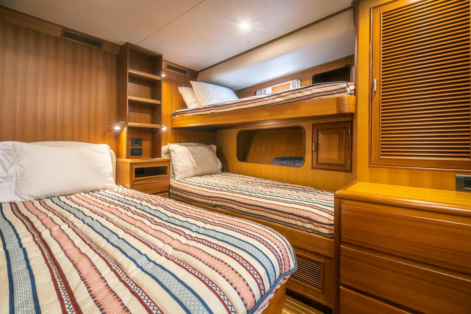 a room with bunk beds aboard PRETTY LADY Yacht for Sale
