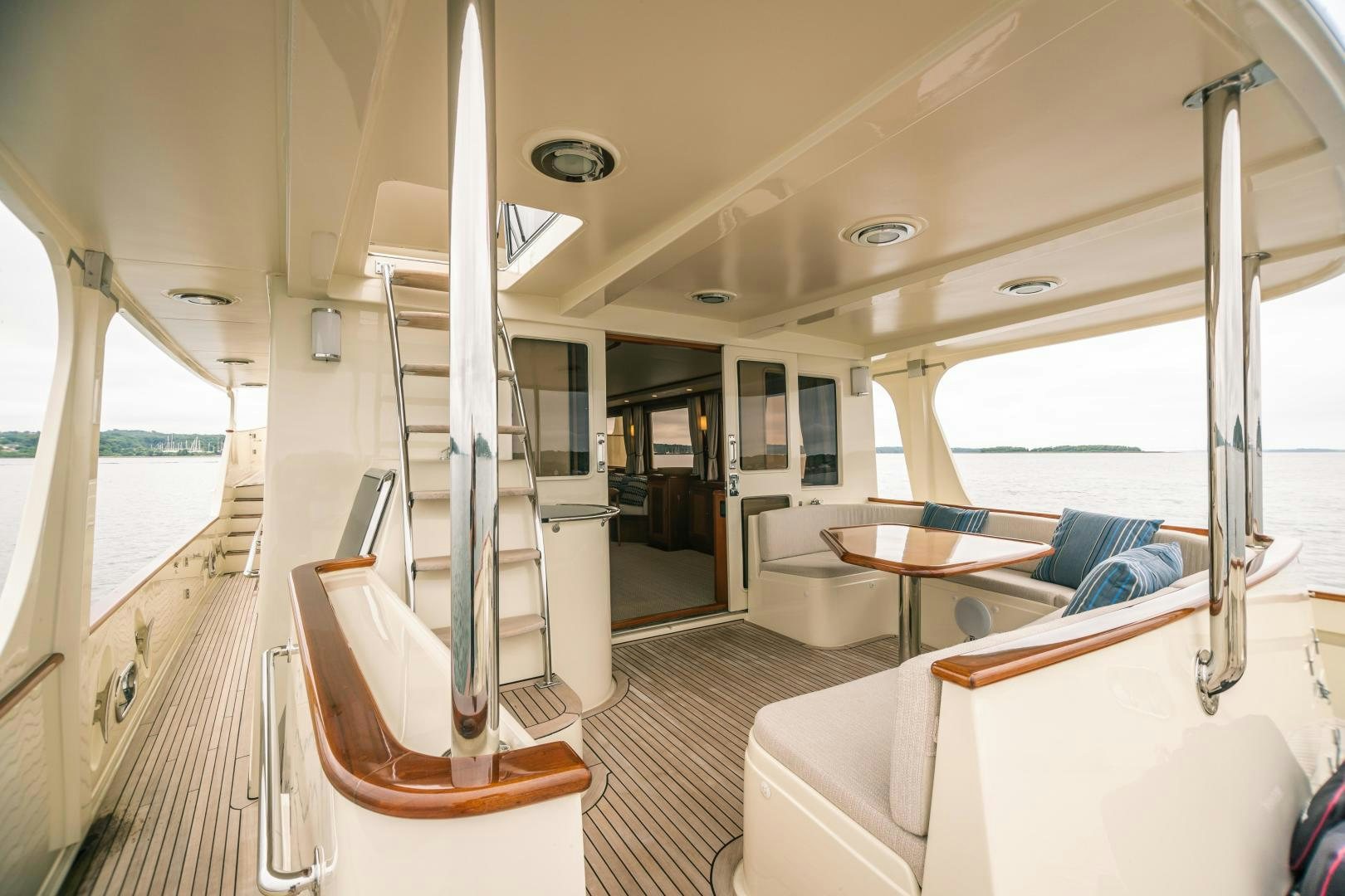 a boat with a table and chairs aboard PRETTY LADY Yacht for Sale