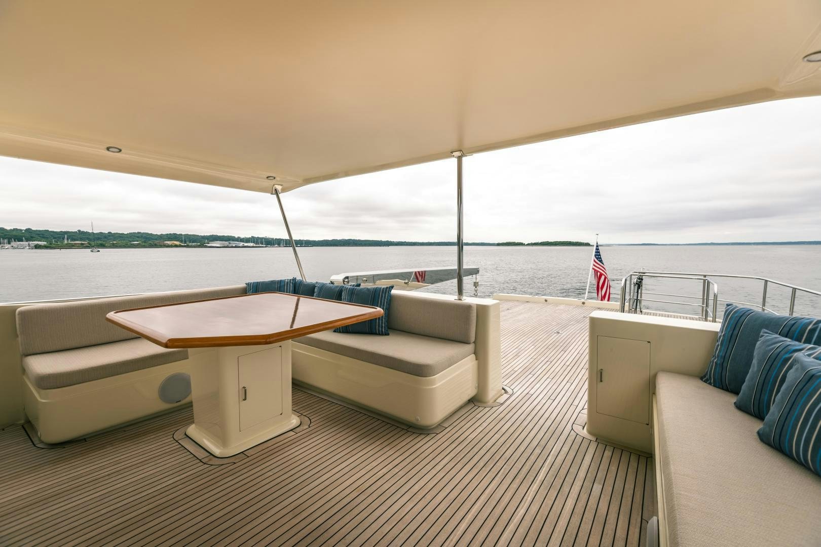 a room with a couch and a table and a large body of water aboard PRETTY LADY Yacht for Sale