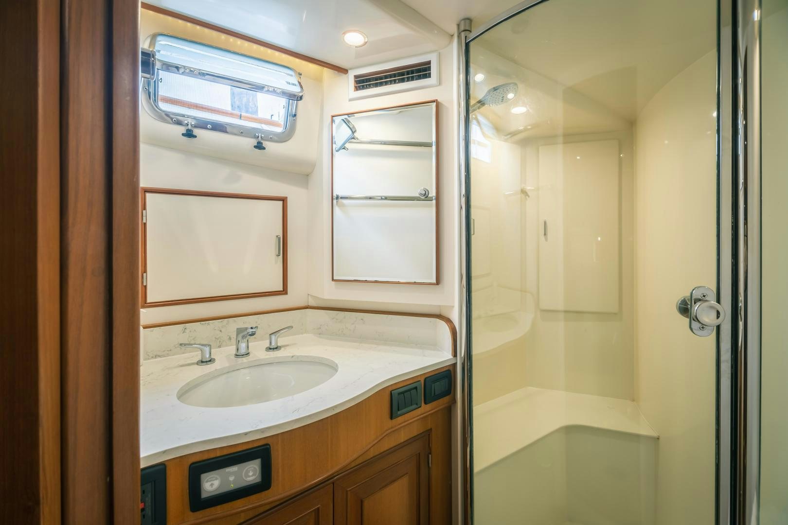 a bathroom with a sink and a shower aboard PRETTY LADY Yacht for Sale