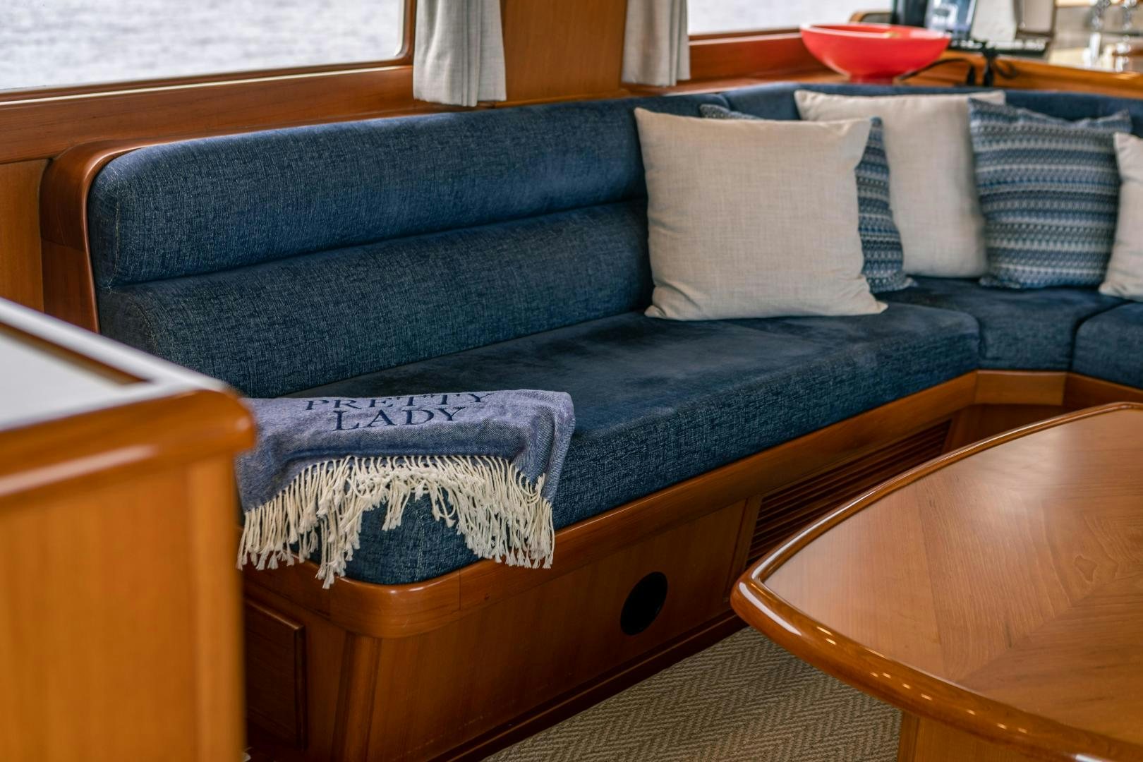 a couch with pillows aboard PRETTY LADY Yacht for Sale