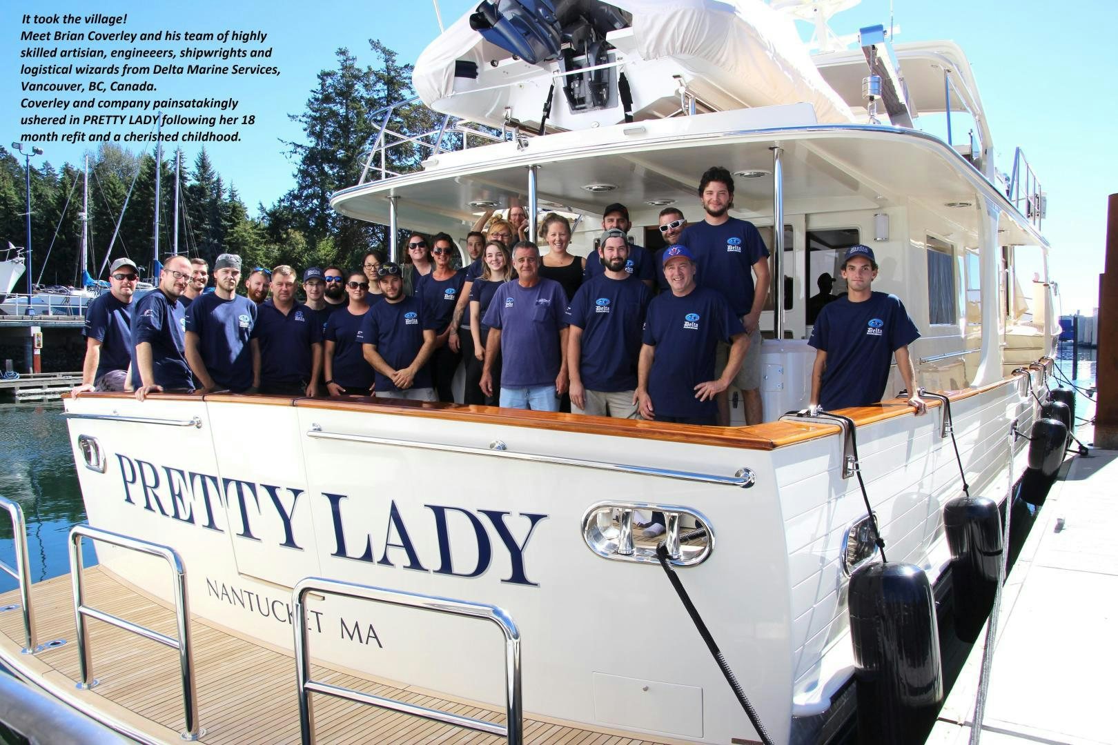 a group of people posing for a photo on a boat aboard PRETTY LADY Yacht for Sale
