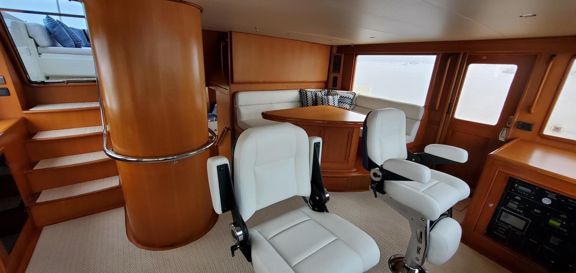 a room with a table and chairs aboard PRETTY LADY Yacht for Sale