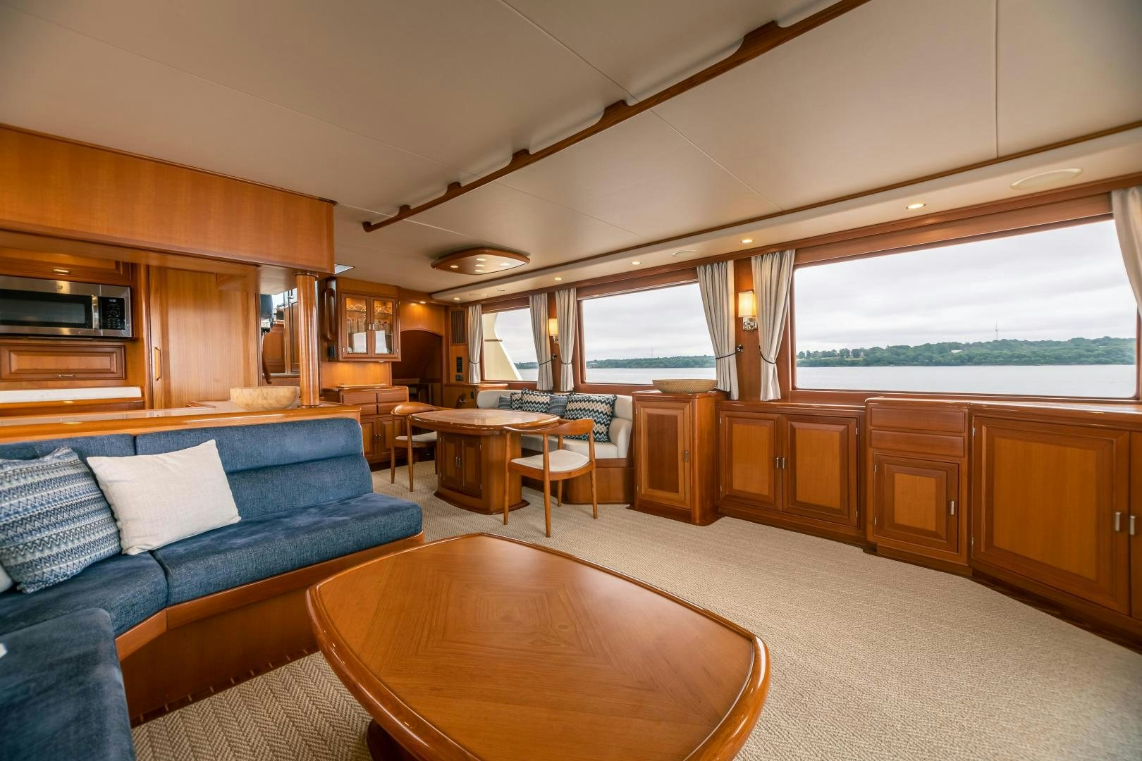 a living room with a couch and a table aboard PRETTY LADY Yacht for Sale