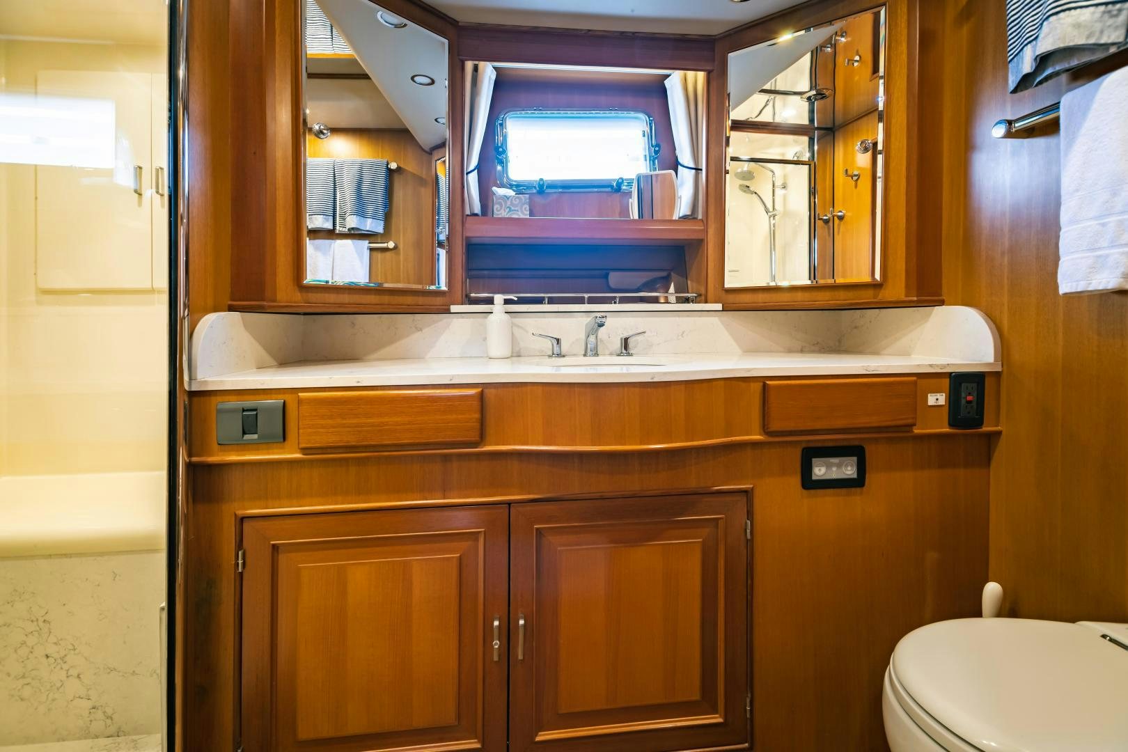 a bathroom with a sink and a toilet aboard PRETTY LADY Yacht for Sale