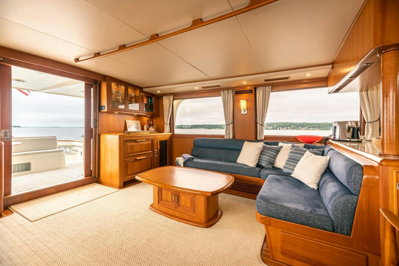 a living room with a couch and a table aboard PRETTY LADY Yacht for Sale