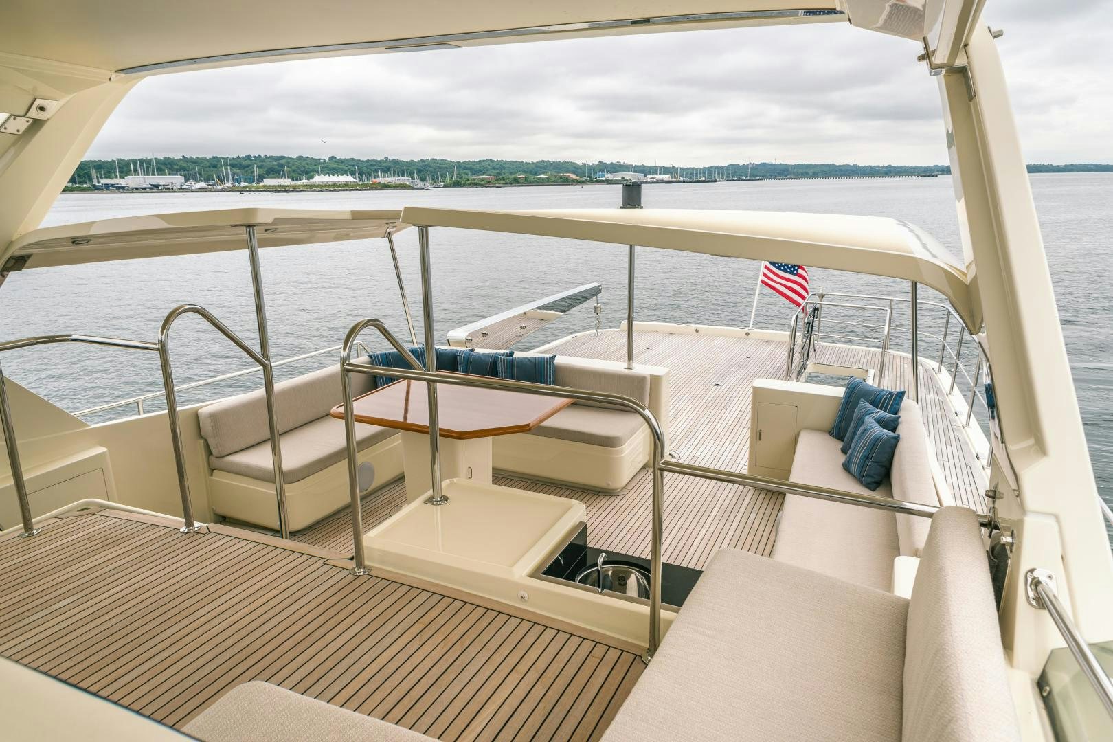 a boat with a flag on the deck aboard PRETTY LADY Yacht for Sale