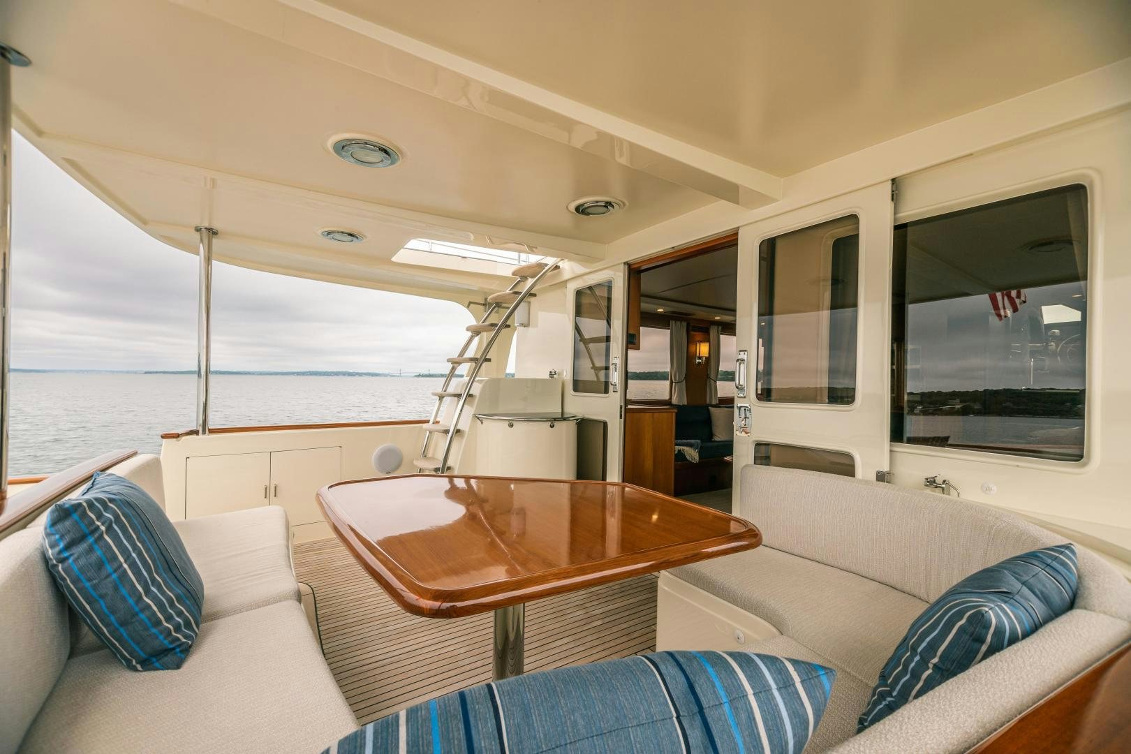 a boat with a table and chairs aboard PRETTY LADY Yacht for Sale