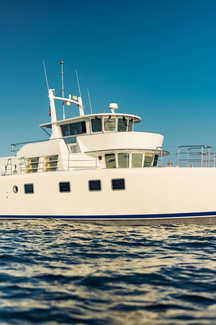a white boat in the water aboard IETA Yacht for Sale