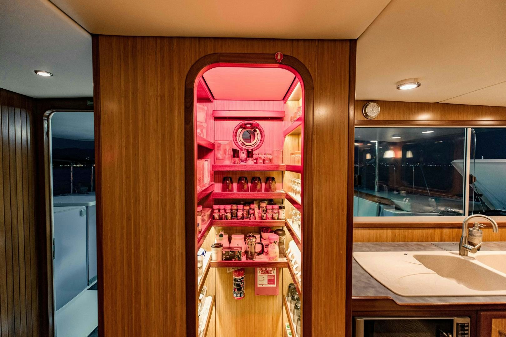 a bathroom with a glass display case aboard IETA Yacht for Sale
