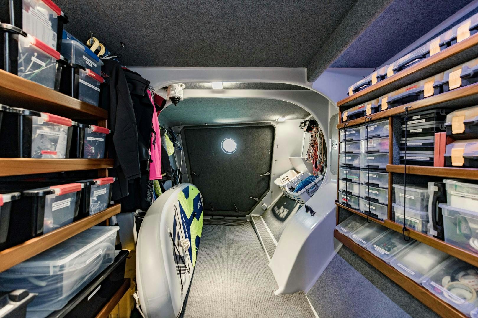 a room with shelves and a television aboard IETA Yacht for Sale