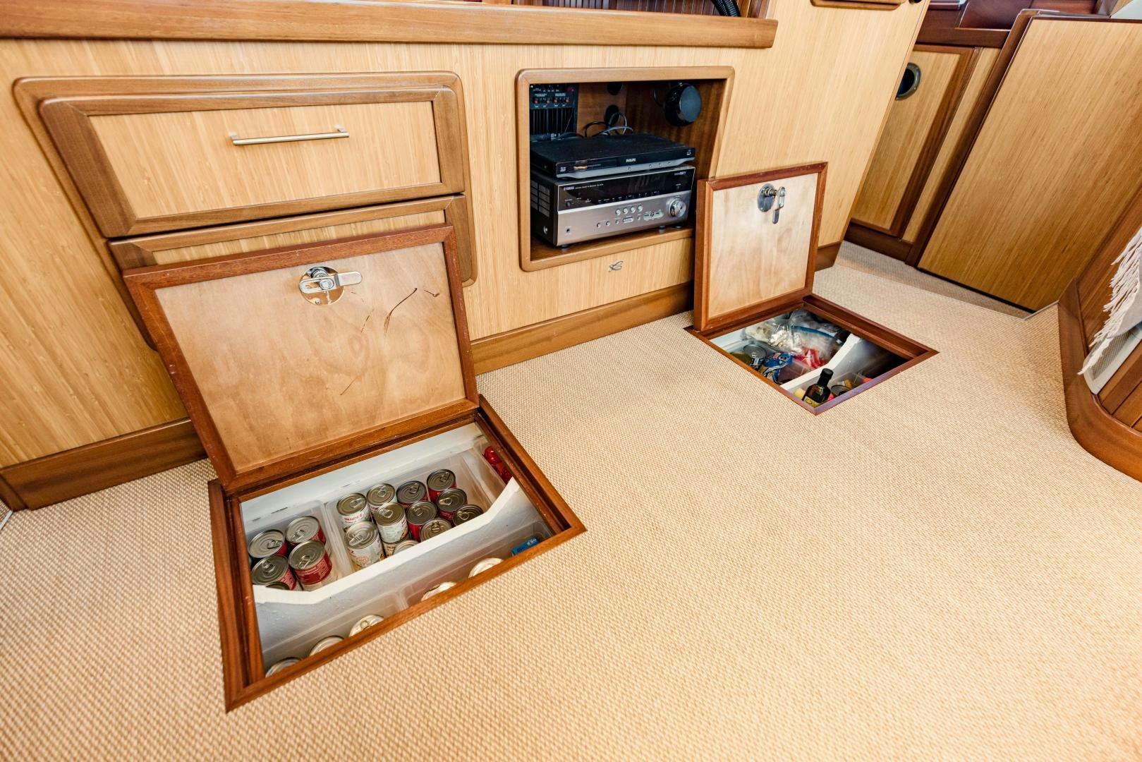 a wooden cabinet with drawers aboard IETA Yacht for Sale